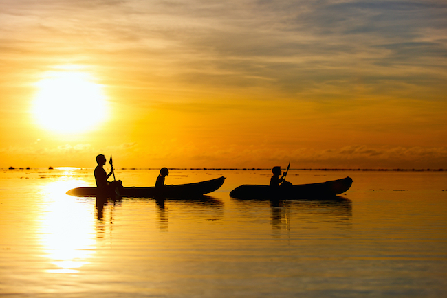 Kayak Fishing Family kayaking at sunset